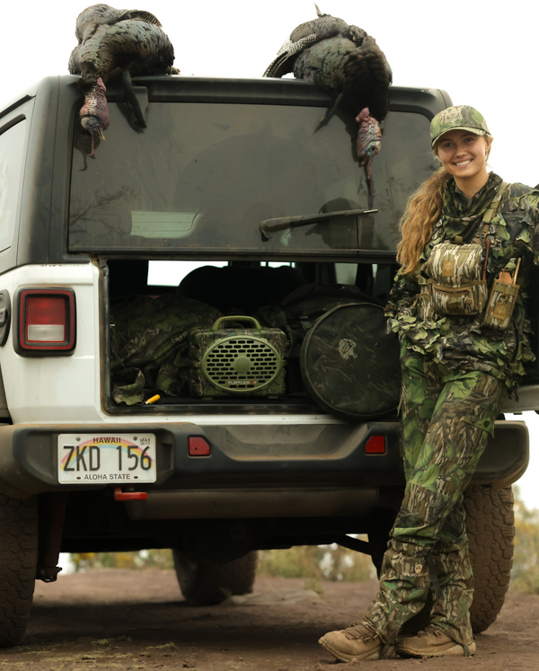 Maggie Williams on a turkey hunt in Hawaii with her Mossy Oak Full Foliage Turtlebox