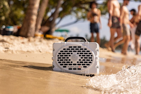 Turtlebox at the beach on the sand and in the waves