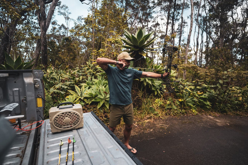 Shane Dorian listening to music on his Turtlebox while bowhunting