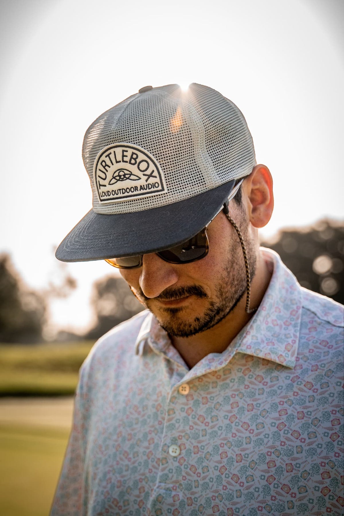 lifestyle photo of a man wearing the all mesh blue cap