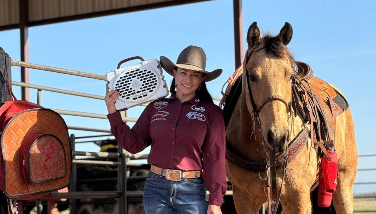 Erica Krantz with her white Turtlebox and her horse