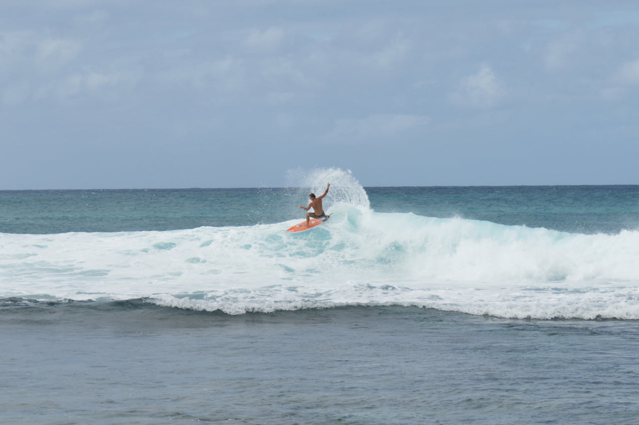 Finn McGill surfing
