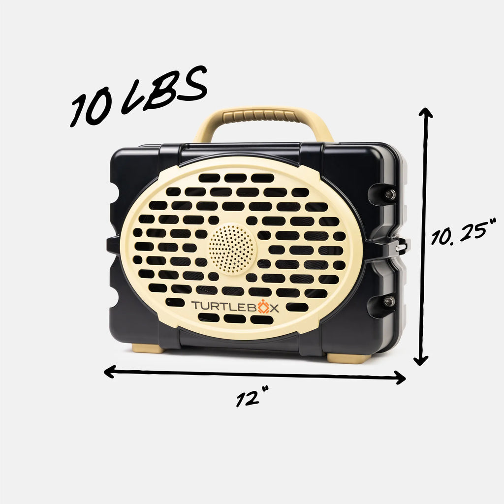 A black and beige Turtlebox portable speaker shown with dimension arrows and text indicating 12 inches wide, 10.25 inches tall, and 10 lbs.
