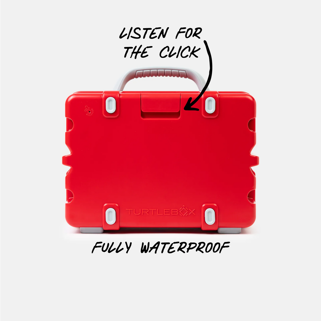 A bright red hard-shell carrying case shown from the back on a light gray background, with overlaid text reading 'LISTEN FOR THE CLICK' pointing to a small latch and 'FULLY WATERPROOF' below. The TurtleBox brand name is faintly visible near the bottom center.