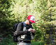 Lifestyle photo of a man fishing wearing a Cotton Oxford Foam-Front Trucker cap