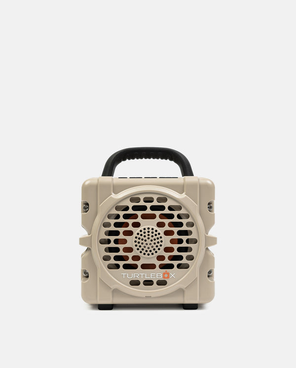 Beige portable speaker with a handle on a white background