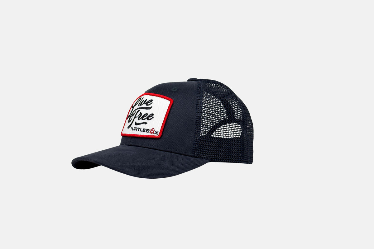 Studio side shot of the Live Free Patch Blue Hat
