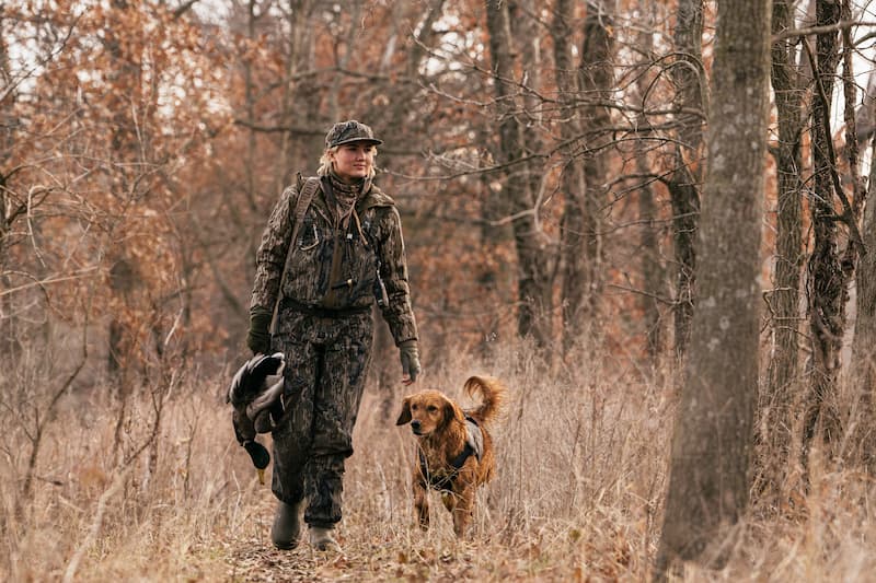 Maggie Williams with her dog on a hunting trip