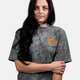 A lifestyle photo showing a girl wearing the Mossy Oak Full Foliage Tee