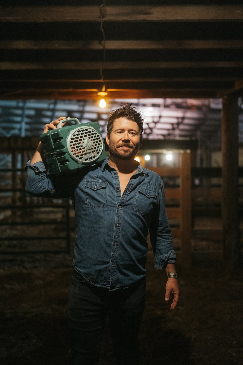 Shane Smith with a Turtlebox speaker on his shoulder