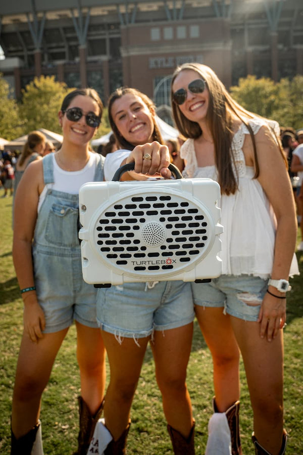 Girls with a Original speaker on their hands