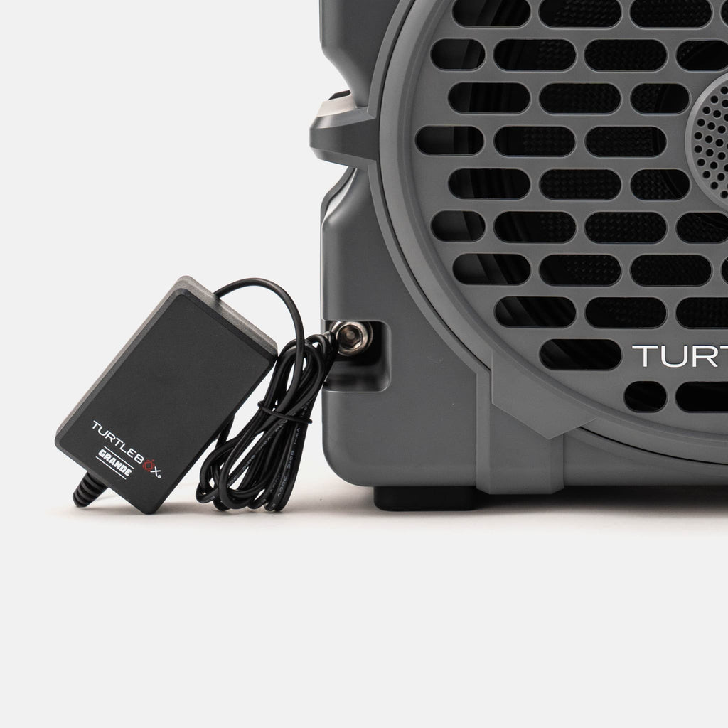 A lifestyle image of a grande charger on a white background