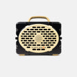 A portable Turtlebox speaker in a black and beige color scheme, shown from the front against a light gray background.