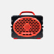 A portable Turtlebox speaker with a black rugged plastic body and bright red accents, including a handle, front grille, and small feet, shown against a light gray background.