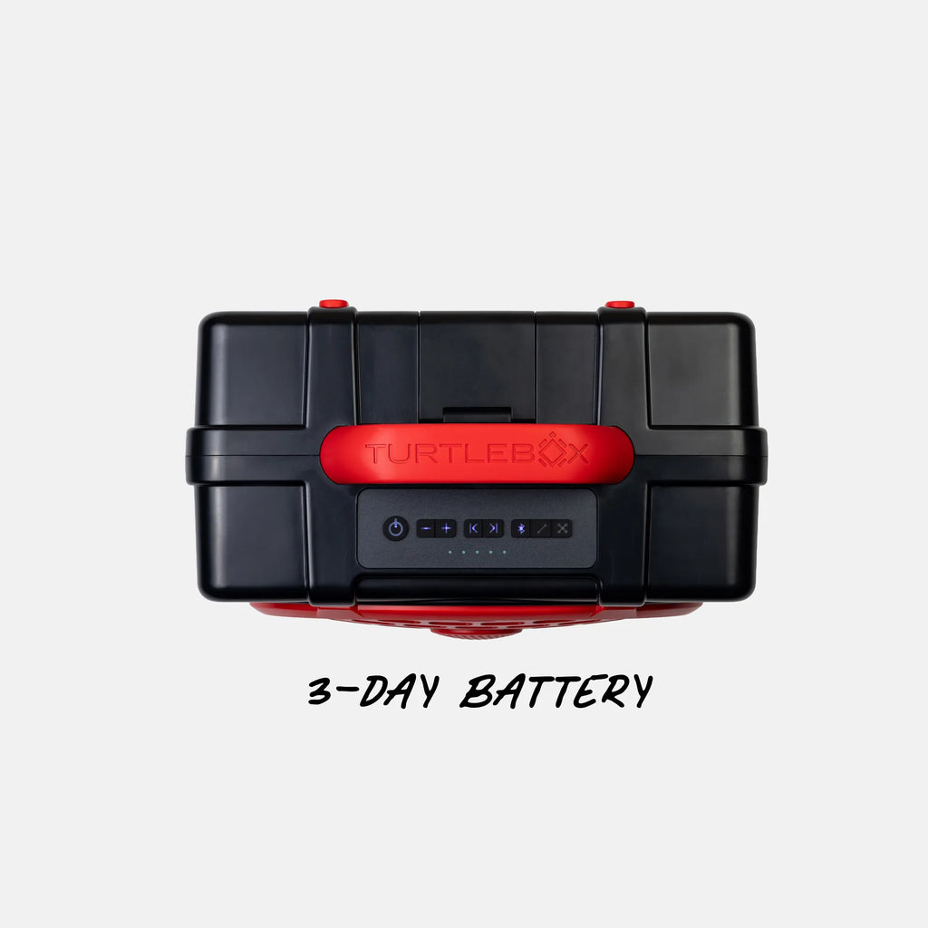 A black Turtlebox portable power station with a red front handle and red latches, shown from a top-down view on a light gray background with the text '3-DAY BATTERY' underneath.