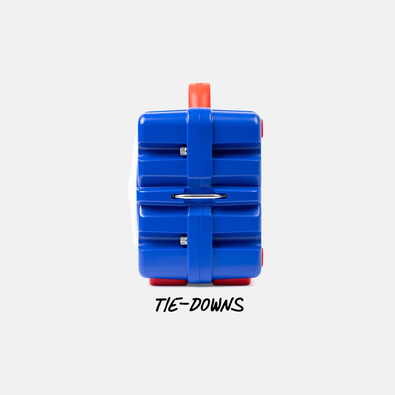 A blue plastic luggage tag-style organizer with red accents and a white side panel, shown from the back on a light gray background with the text 'TIE-DOWNS' underneath.