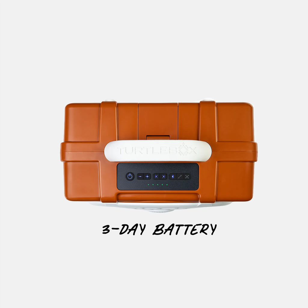 An orange hard-sided portable power station with a white handle and a black front control panel, shown from above on a light gray background with the text '3-DAY BATTERY' underneath.