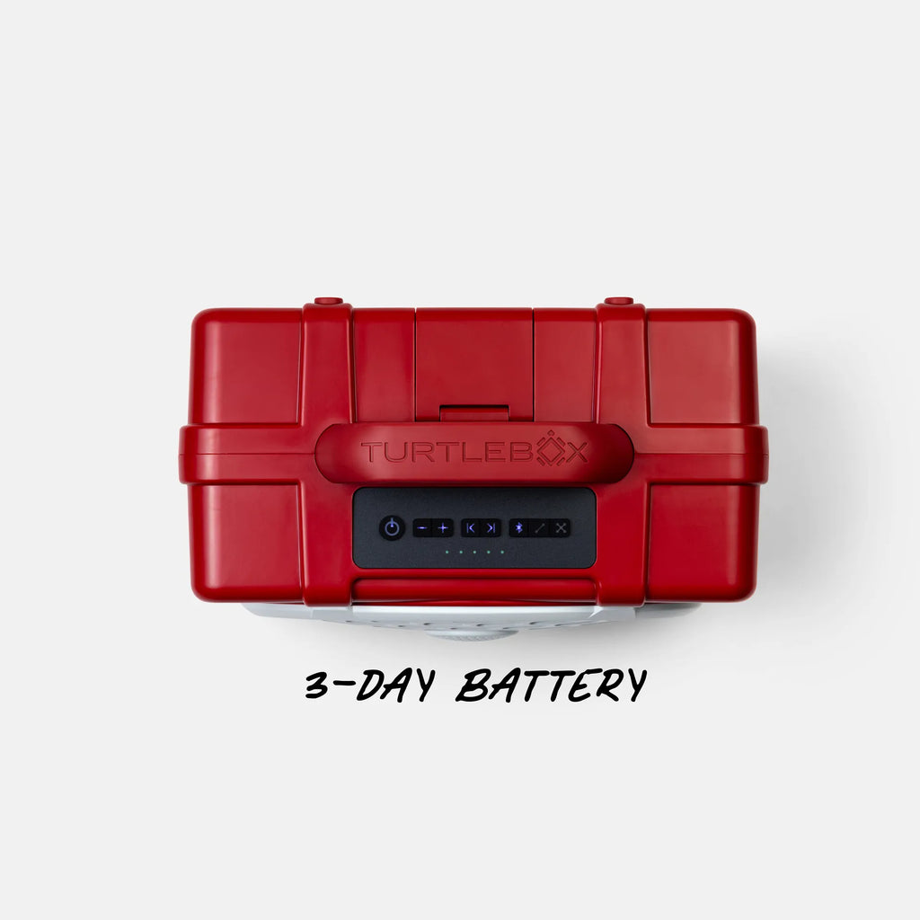 A red hard-sided portable power station with a black front battery display panel and the TURTLEBOX logo, shown from above on a light gray background with the text '3-DAY BATTERY' below.