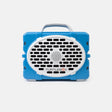 A blue and white portable speaker by TurtleBox, featuring a rugged rectangular body, a top carry handle, and a large oval front grille with the brand name printed on it.