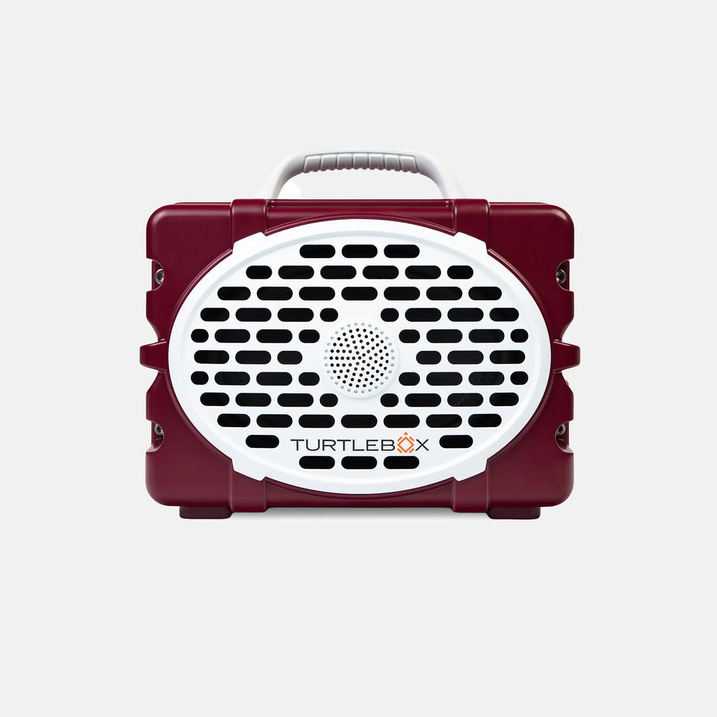 A maroon and white TurtleBox portable speaker with a carrying handle, shown against a light gray background.