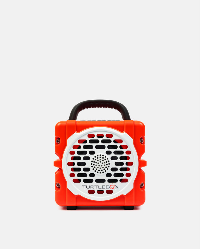 Red portable device with a handle and 'Turtle Beach' logo on a white background