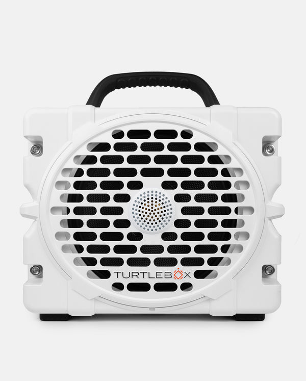 White portable speaker with black handle and grille on a white background