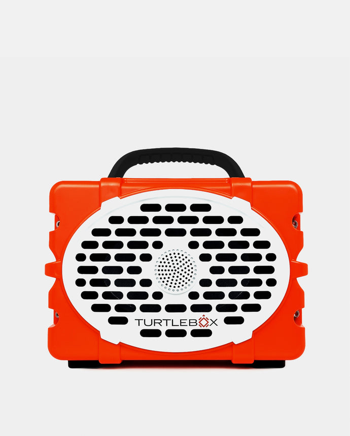 Orange and black portable device with 'TurtleBox' branding on a light gray background