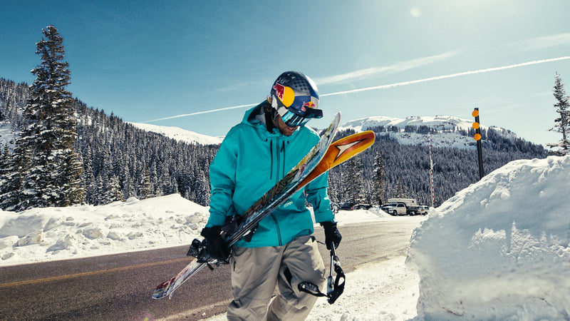 Turtlebox ambassador Bobby Brown carrying his skies 