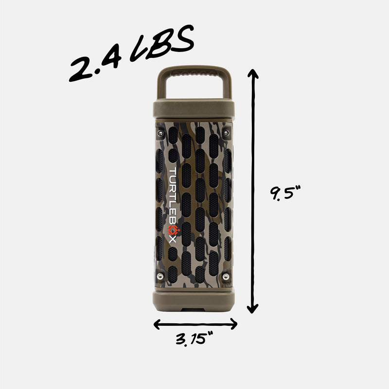 A portable cylindrical speaker with a camouflage pattern and black vent holes, shown with dimension lines indicating 9.5 inches tall, 3.