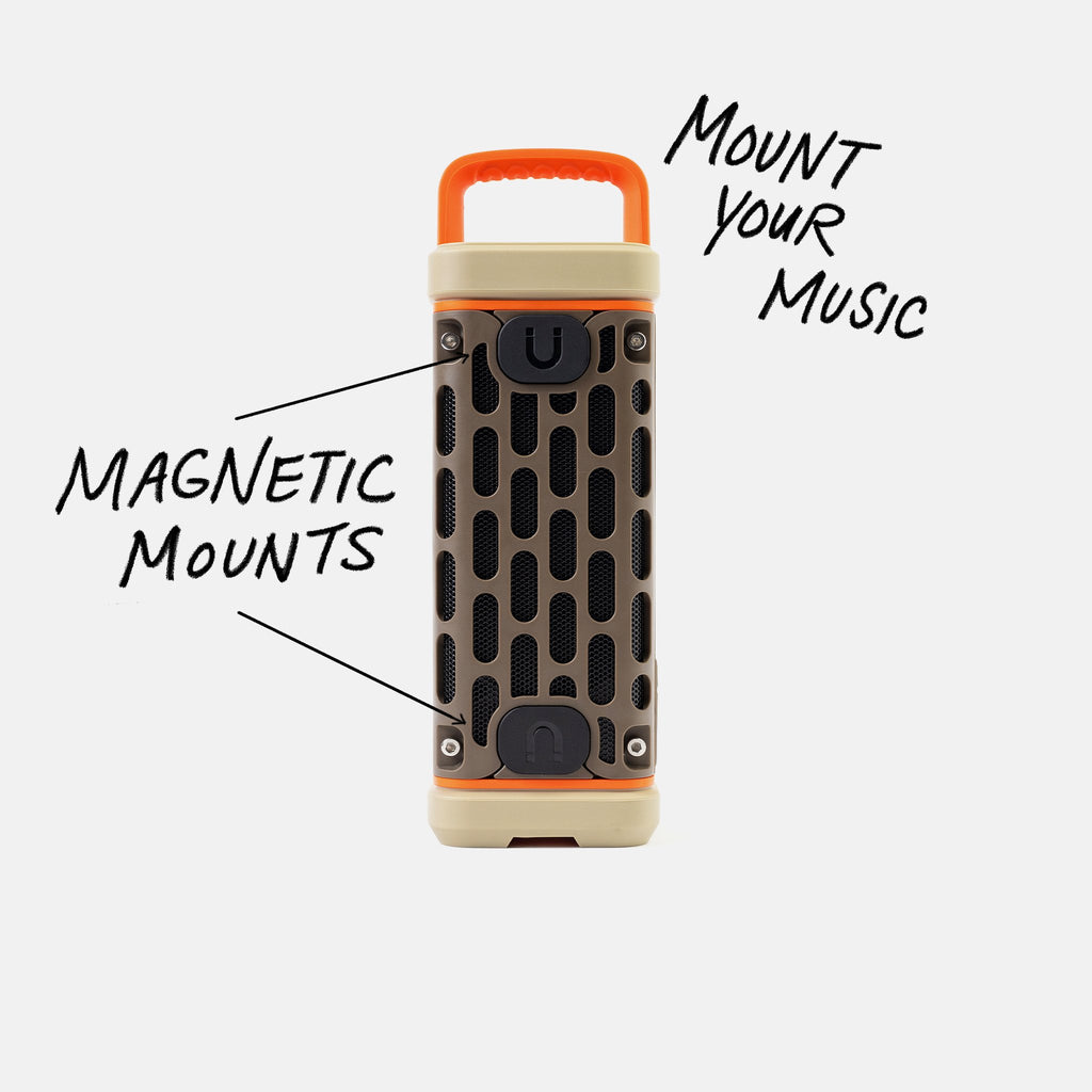 Studio shot of a Delta Ranger speaker calling out Mount your Music and showcasing the magnetic mounts.  #base-color_delta