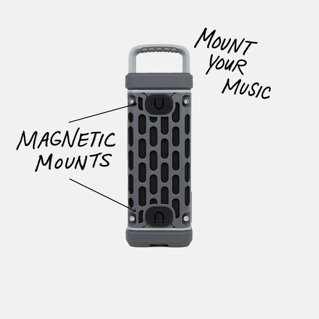 Studio shot of a Gray Ranger speaker calling out Mount your Music and showcasing the magnetic mounts. #base-color_gray