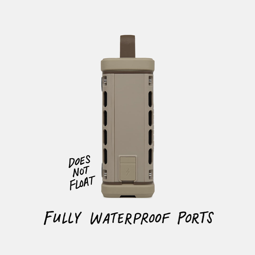 Studio shot of a Tan Ranger speaker calling out  the speaker does not float but does have fully waterproof ports. #base-color_tan