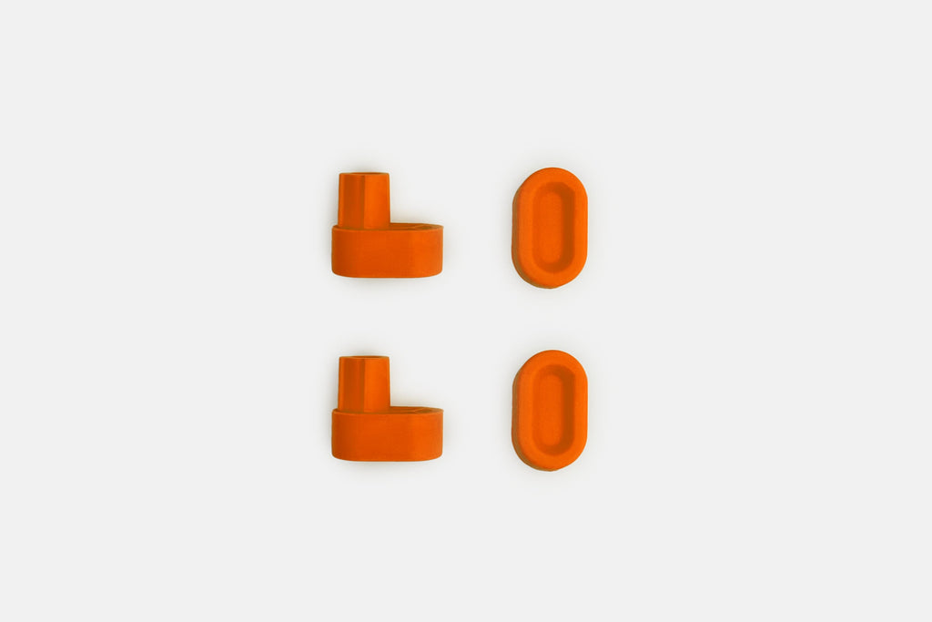 Studio photo showing the blaze orange rubber feet  on a white background #feet-color_blaze-orange