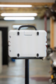 lifestyle photo showing the gray rubber feet on the back of a white Turtlebox  #feet-color_gray