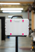 Lifestyle photo showing the hot pink rubber feet on the back of a white Turtlebox lifestyle #feet-color_hot-pink