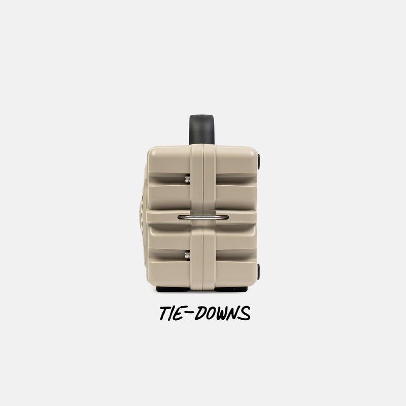 Tan speaker with black tie-downs on a white background #base-color_tan