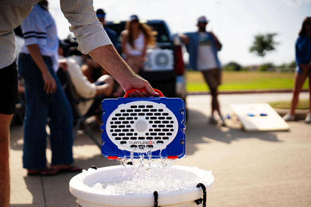 A lifestyle photo of a Blue & Orange Original Gen 3 speaker. #speaker-color_blue-orange-gameday-series