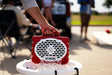 A lifestyle photo of a Crimson & White Original Gen 3 speaker. #speaker-color_crimson-white-gameday-series
