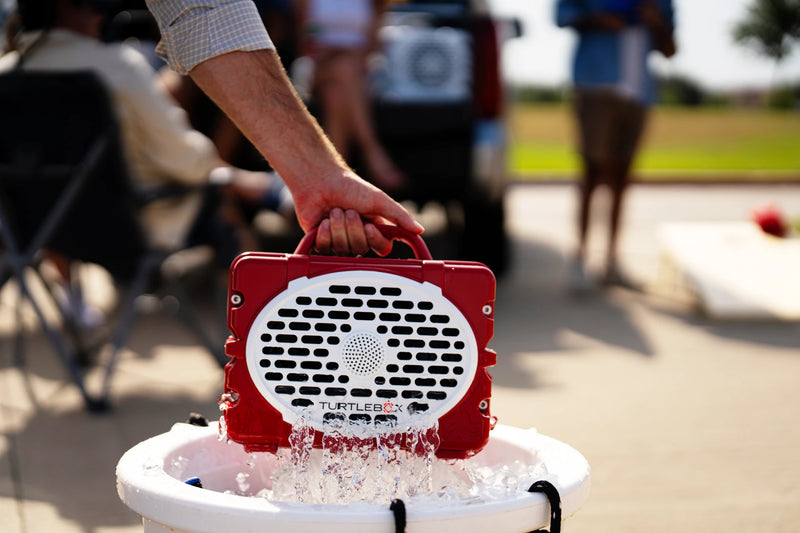 A lifestyle photo of a Crimson & White Original Gen 3 speaker. #speaker-color_crimson-white-gameday-series