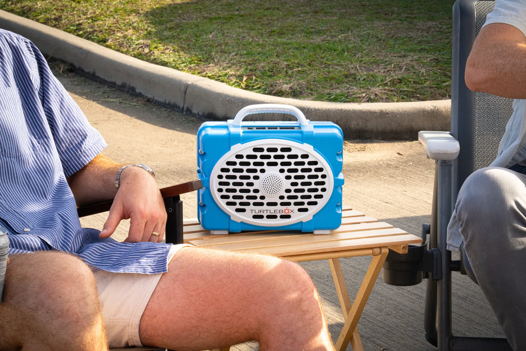 A lifestyle photo of a Light Blue & White Original Gen 3 speaker. #speaker-color_light-blue-white-gameday-series