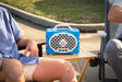 A lifestyle photo of a Light Blue & White Original Gen 3 speaker. #speaker-color_light-blue-white-gameday-series