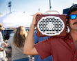 A lifestyle photo of a Maroon & White Original Gen 3 speaker. #speaker-color_maroon-white-gameday-series