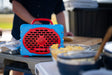 A lifestyle photo of a Powder Blue & Red Original Gen 3 speaker. #speaker-color_powder-blue-red-gameday-series