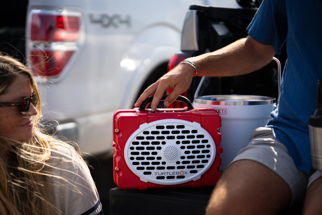 A lifestyle photo of a Red & White Original Gen 3 speaker. #speaker-color_red-white-gameday-series