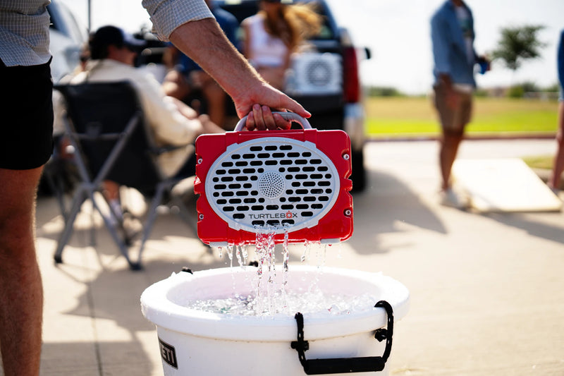 A lifestyle photo of a Scarlet & Gray Original Gen 3 speaker. #speaker-color_scarlet-gray-gameday-series