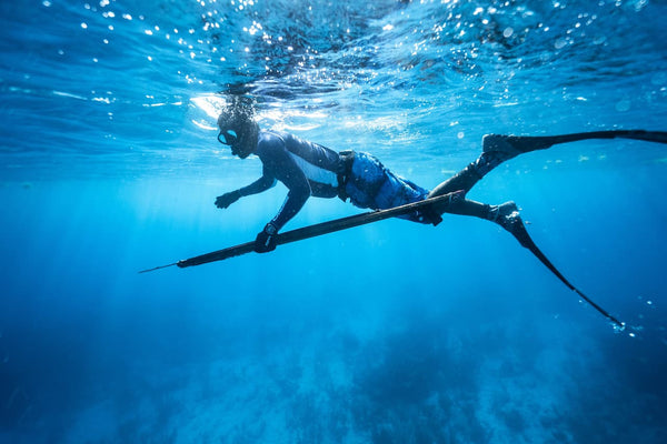 A diver doing submarine fishing with his harpoon