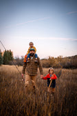 A lifestyle photo of a family with kids hanging a Ranger speaker in orange and a fishing net #base-color_orange