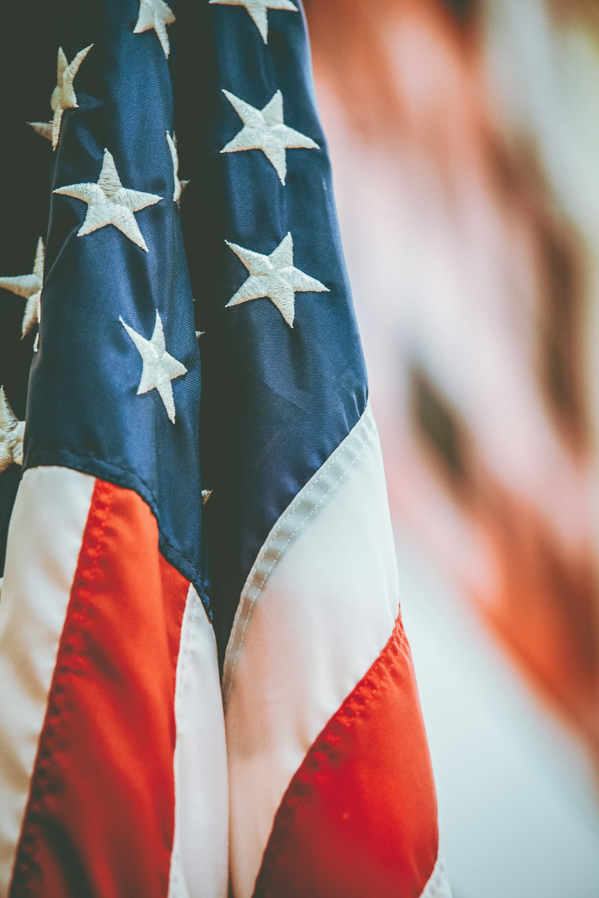 Close-up of an American flag with a blurred background