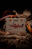 A lifestyle image of Original Gen 3 speaker showing the Western variant, a tan burnt orange speaker with a Rodeo paint from Teal Blake artist