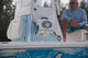 A lifestyle image with a guy in a boat and with the Original Gen 3 in the Boat mount support #mount-color_white